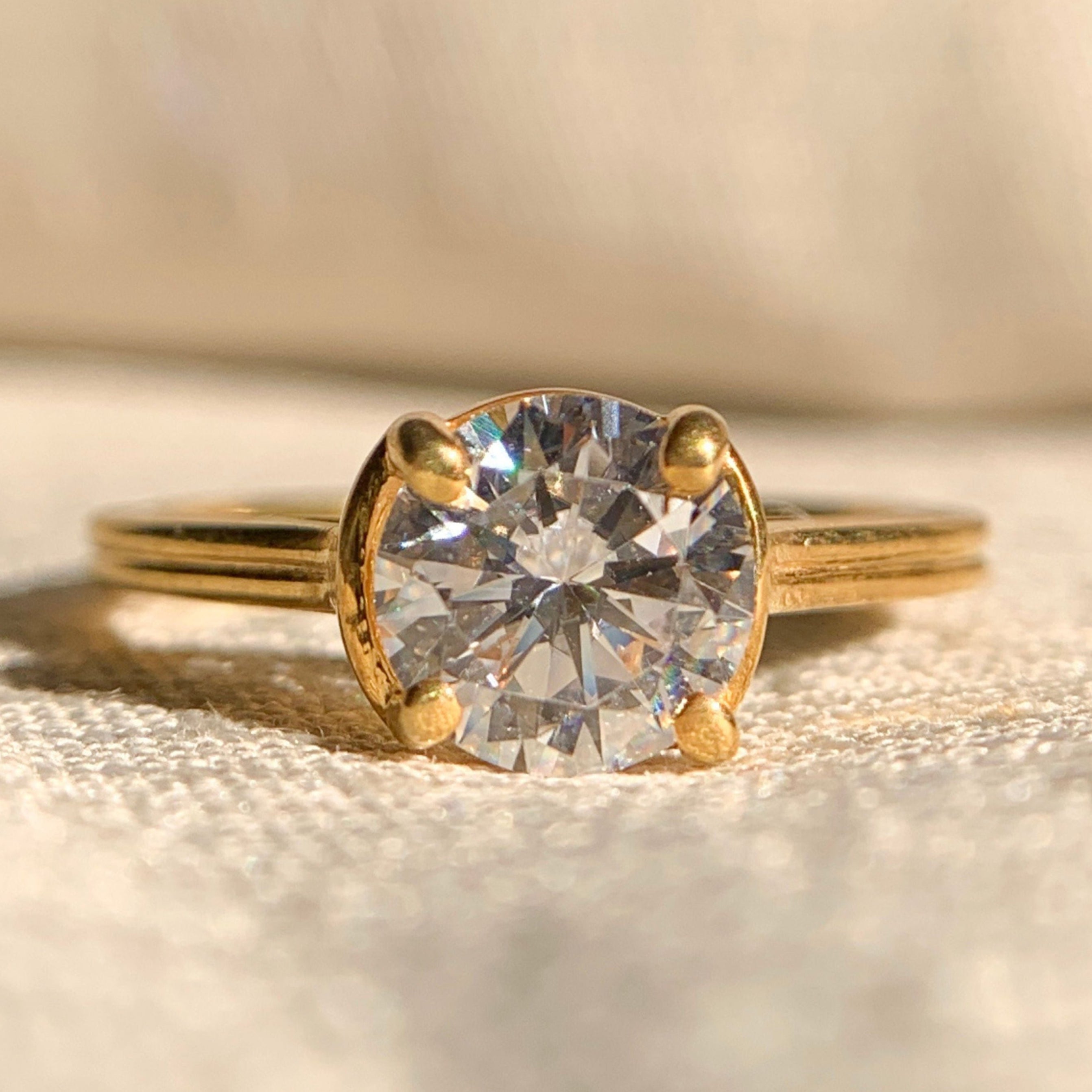 Classic round cut diamond solitaire engagement ring in white gold